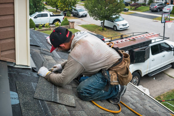 Professional Roofing technician working in Blue Grass, IA